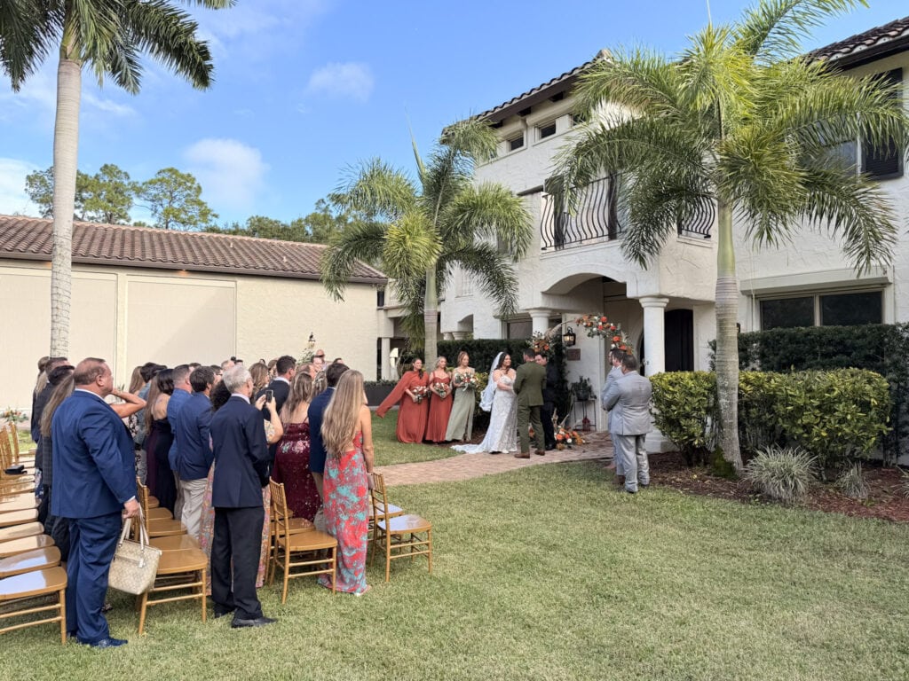 Melissa and Zach getting married in front of a Mediterranean Italian villa at Bonita Ranch wedding venue in Melbourne Florida