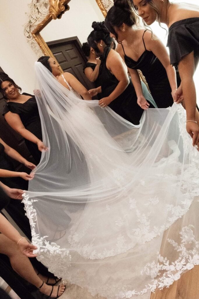 Bride getting ready with bridesmaids in the bridal suite at Bonita Ranch wedding venue in Melbourne Florida
