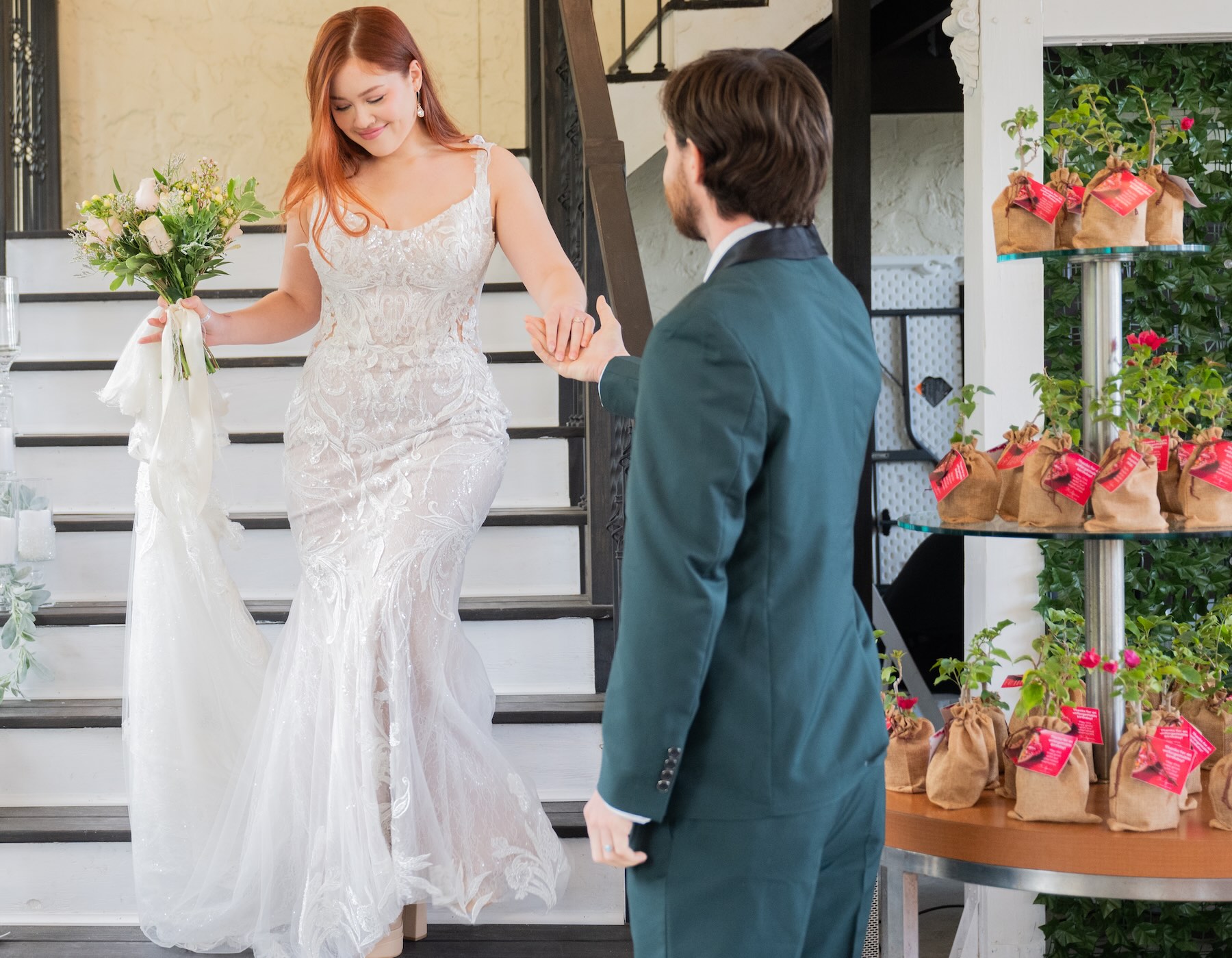 Bride and groom grand entrance at Bonita Ranch with plant party favors displayed as wedding decor in Melbourne Florida