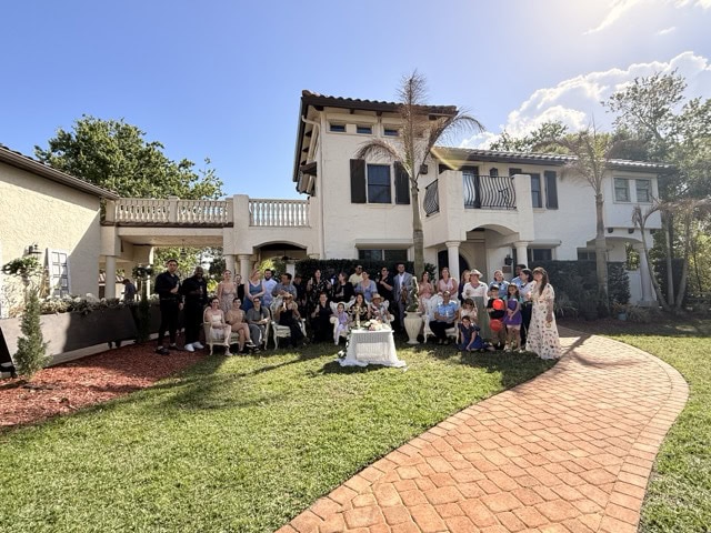 Vendors group photo at Let Love Bloom wedding showcase at Bonita Ranch Mediterranean garden venue in Melbourne Florida