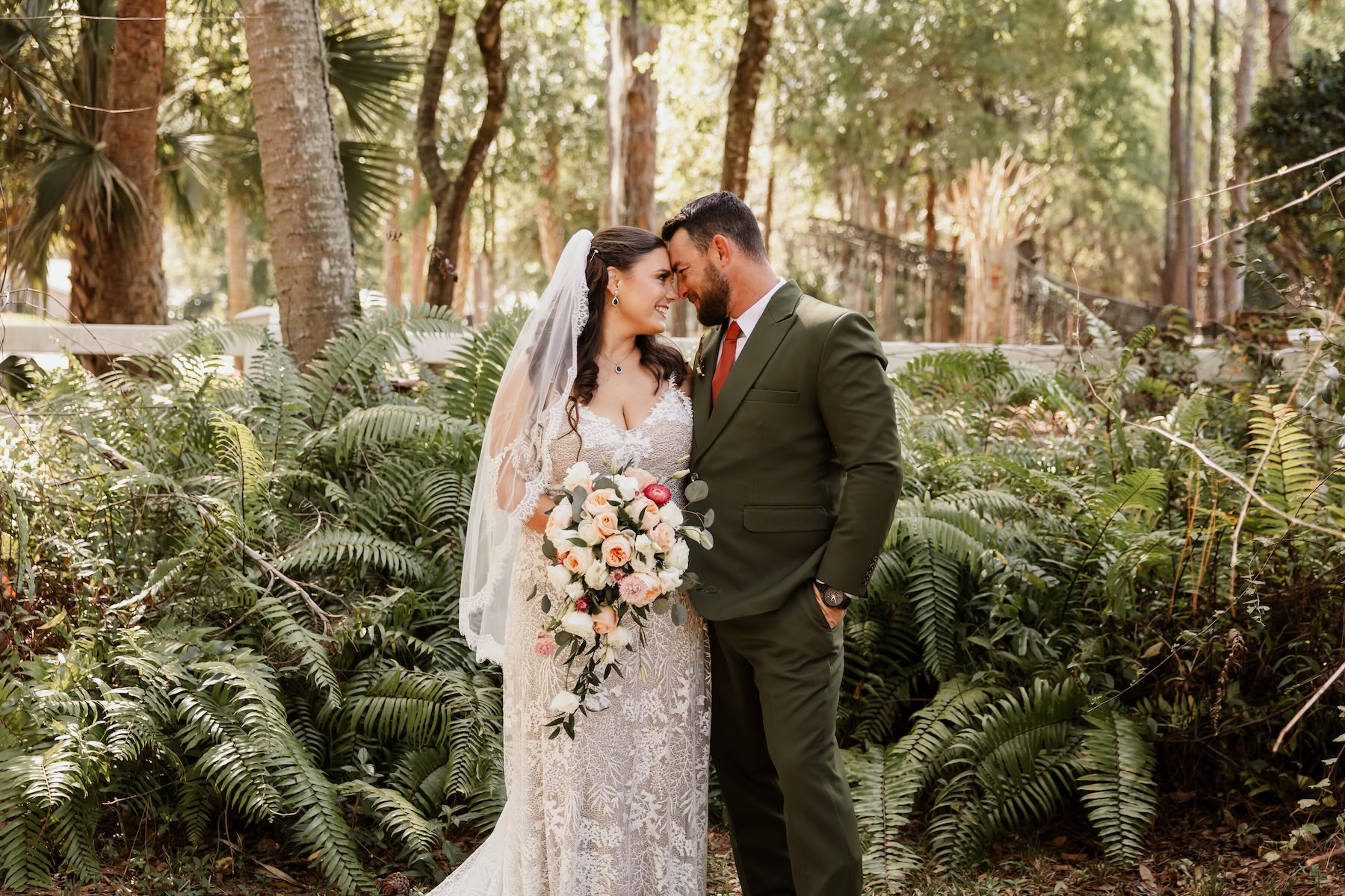 Bride and groom kissing at elopement micro wedding venue in Melbourne Florida Brevard County Bonita Ranch garden wedding
