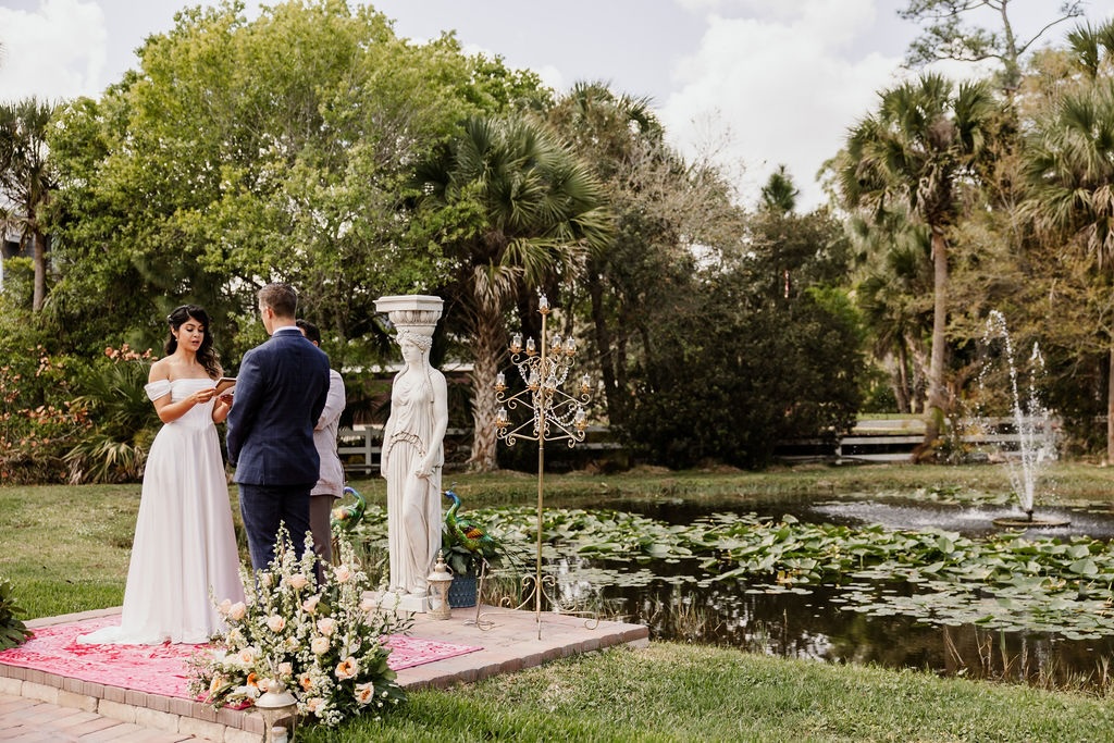 Garden elopement ceremony by the water at Bonita Ranch wedding venue in Melbourne Florida