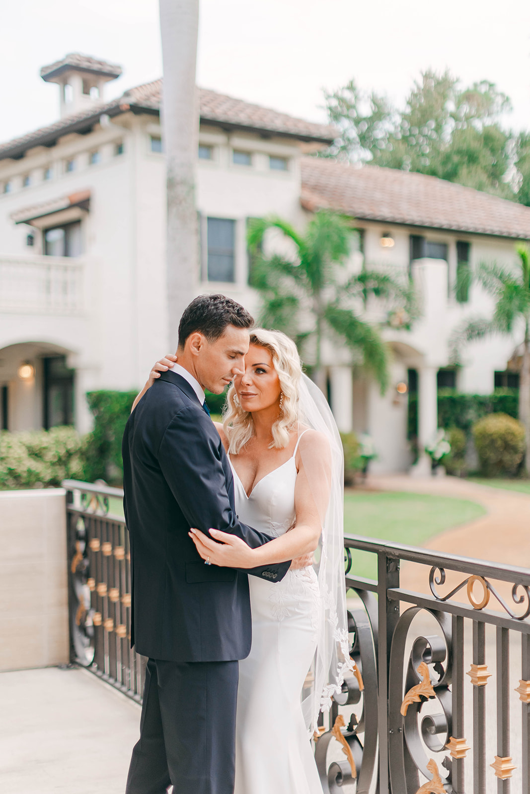 Elegant couple embracing at a luxury Mediterranean-style wedding venue in Melbourne, Florida at Bonita Ranch, perfect for intimate weddings, micro weddings, and destination weddings in Brevard County