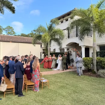 Melissa and Zach getting married in front of a Mediterranean Italian villa at Bonita Ranch wedding venue in Melbourne Florida
