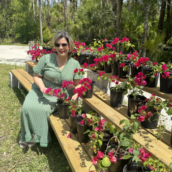 Customer shopping for flowering plants and tropical greenery at Bonita Ranch Nursery in Melbourne, Florida.